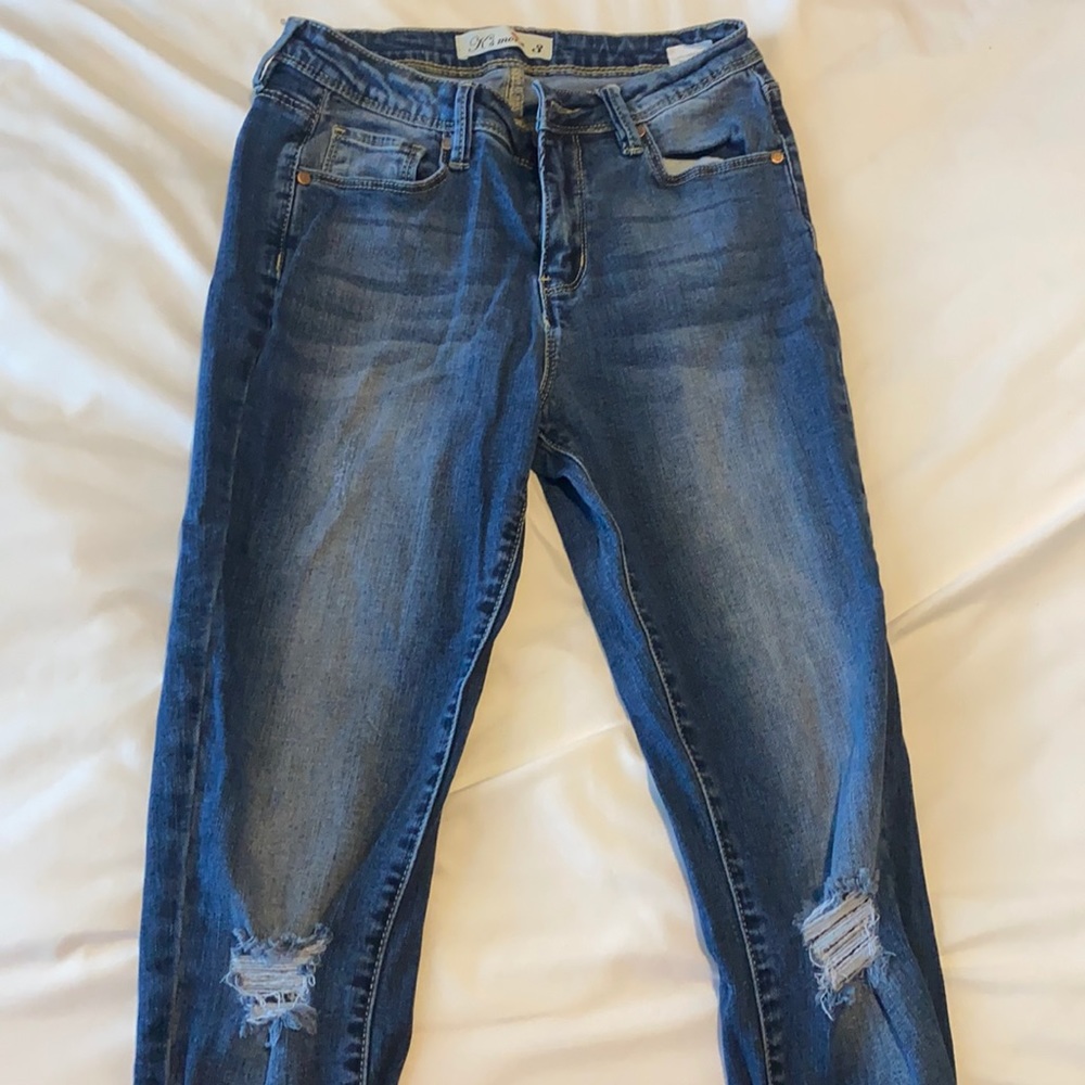 Dark blue ripped jeans